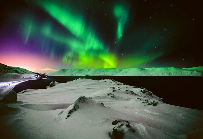 Northern lights in Iceland in December over looking a lake